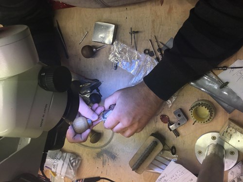 Our expert diamond setter sets the stones in a handmade engagement ring