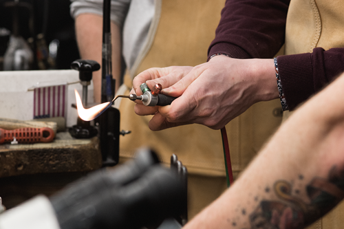 goldsmith using a blow torch